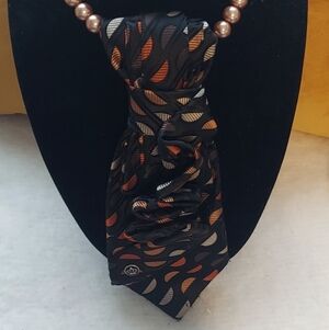 Women's Black Silk-Feel Tie with Orange and Cream Wave Motif